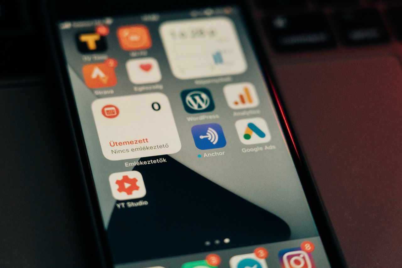 Home Close-up view of smartphone screen featuring various app icons and notifications.